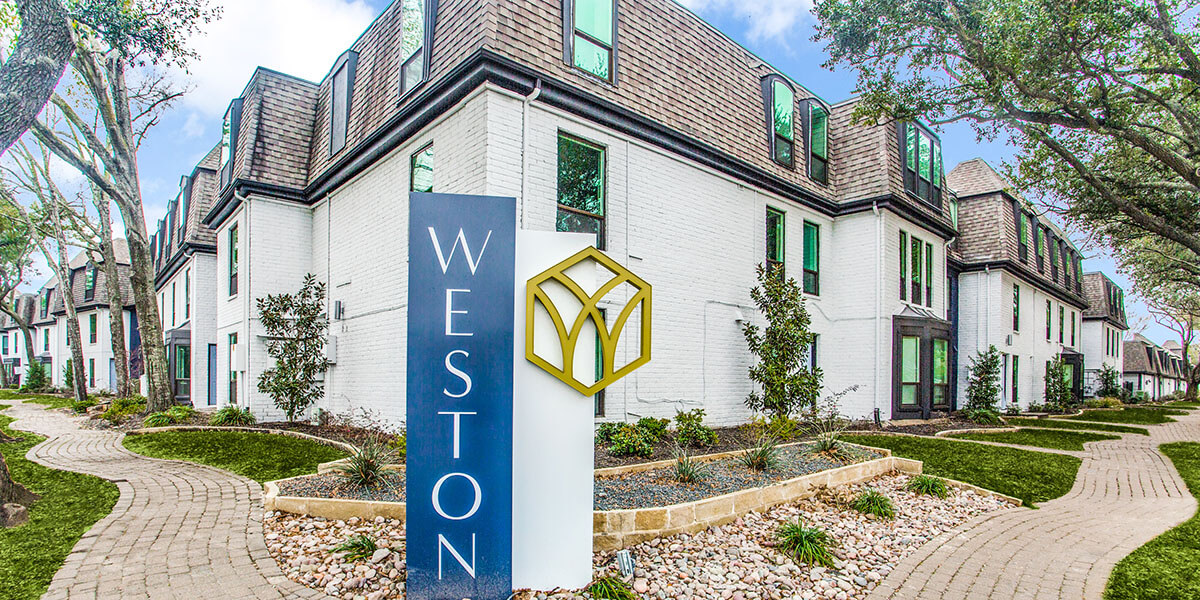 the sign for weston apartments in austin, texas at The WESTON