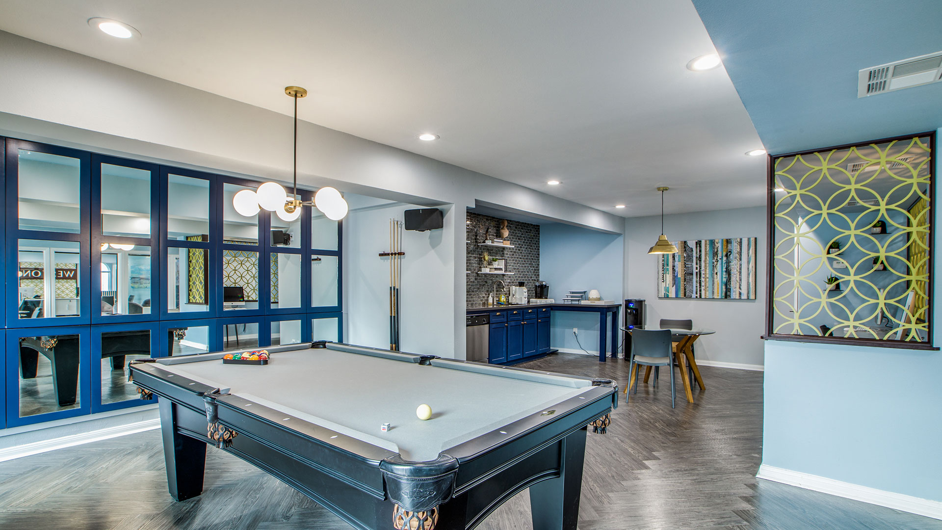 a pool table in a home with blue walls at The WESTON