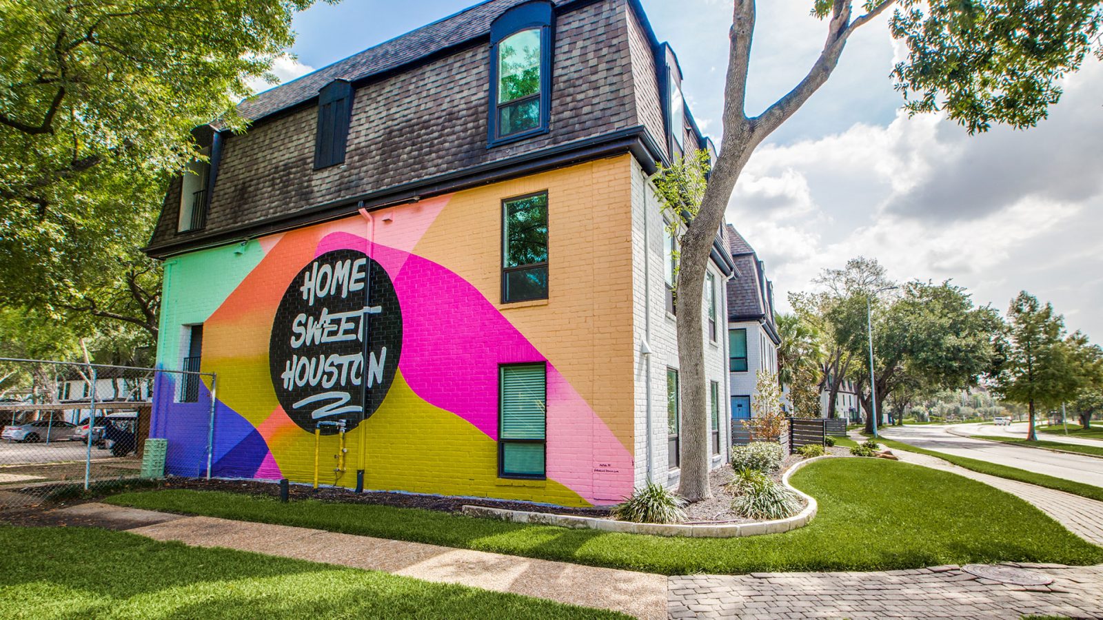 a colorful building with a sign that says, the best place to live at The WESTON