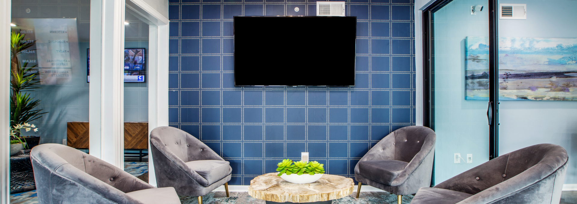 the living room features blue walls and a flat screen tv at The WESTON