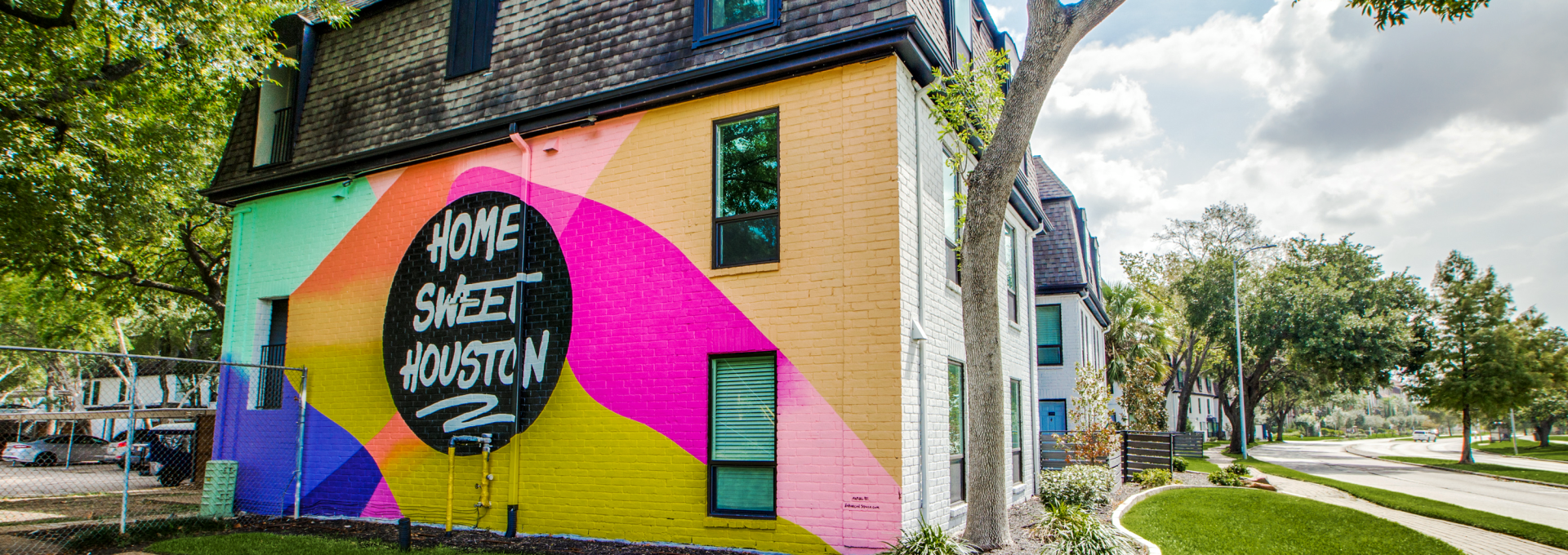 a colorful building with a sign that says, the best place to live at The WESTON