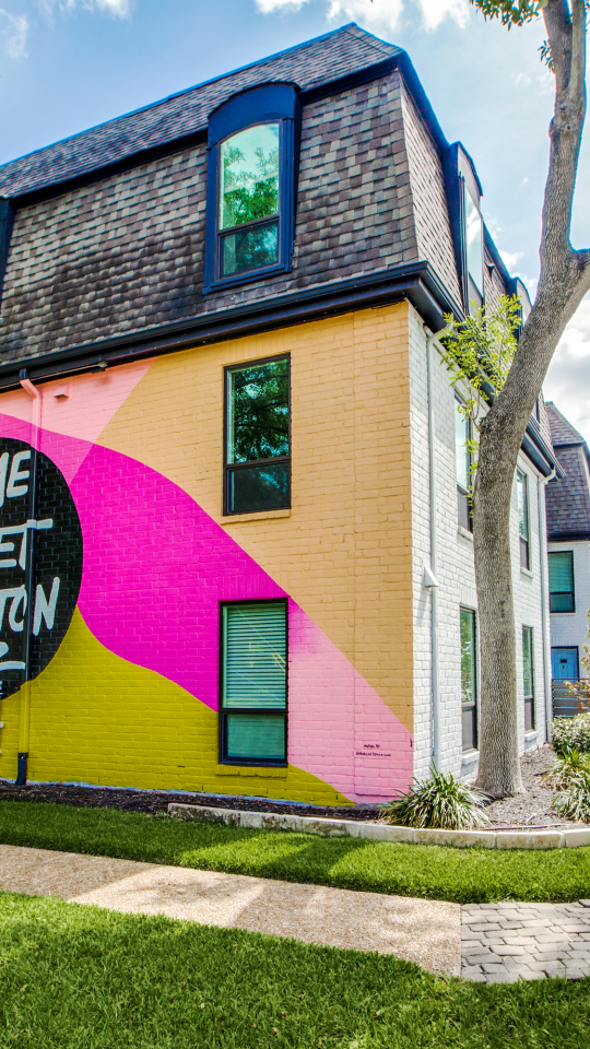 a colorful building with a sign that says, the best place to live at The WESTON