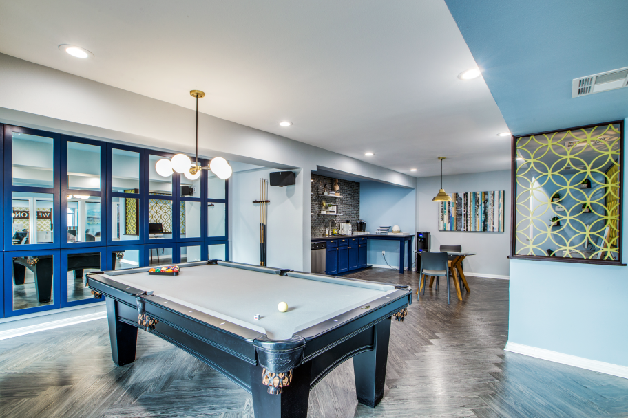 a pool table in a home with blue walls at The WESTON