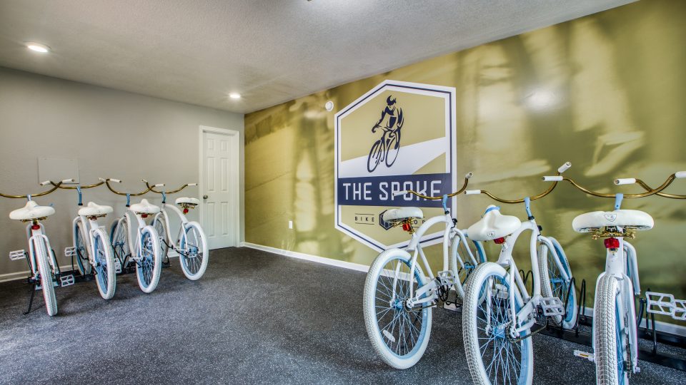 a room with bicycles and a sign that says the bike at The WESTON